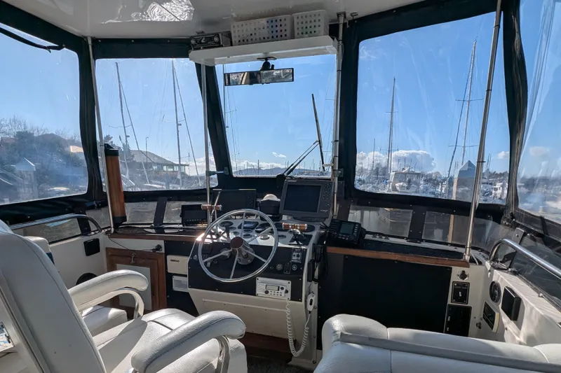 Slide: The Image of Cockpit of 1984 Californian 38 yacht with steering wheel and navigation equipment. - 27