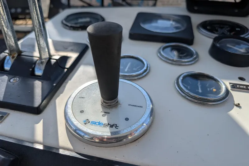 Slide: The Image of Control panel of a 1984 Californian 38 boat with SideShift thruster joystick. - 28