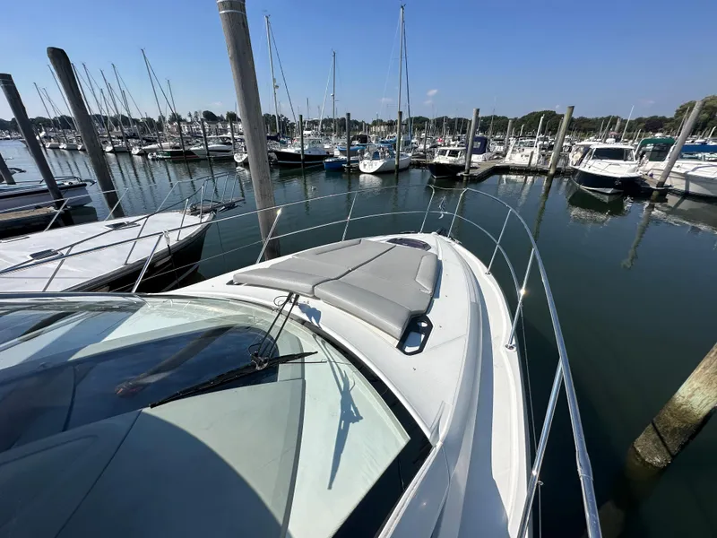 Slide: The Image of 2013 Beneteau Gran Turismo 38 yacht docked in a marina under clear blue skies. - 10