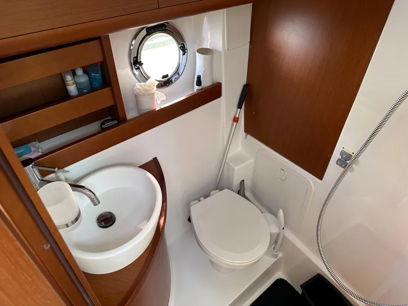 Slide: The Image of Compact bathroom in 2013 Beneteau Gran Turismo 38 yacht with sink, toilet, and shower. - 22