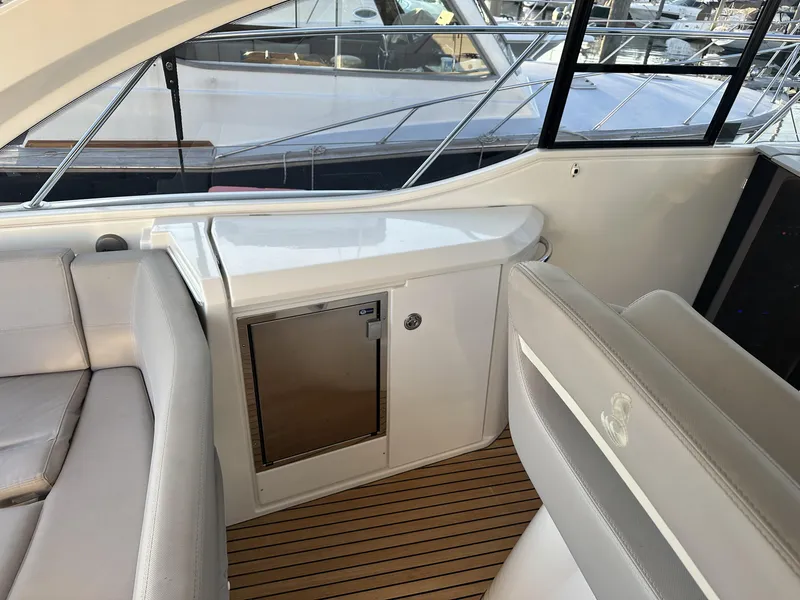 Slide: The Image of Interior of 2013 Beneteau Gran Turismo 38 yacht with seating and mini fridge. - 5