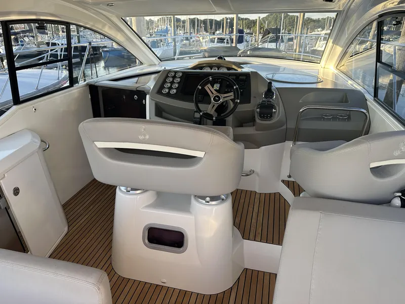 Slide: The Image of 2013 Beneteau Gran Turismo 38 yacht interior with modern helm and seating. - 6