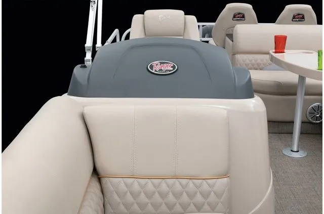 Slide: The Image of Interior of a 2022 Ranger 223FC boat with beige seating. - 26