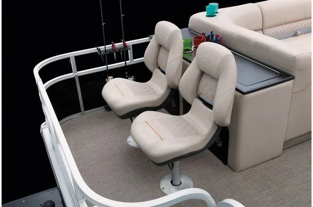 Slide: The Image of Interior of 2022 Ranger 223FC with beige seats and fishing rods. - 38