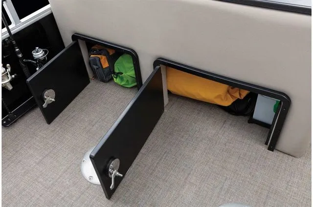 Slide: The Image of Storage compartments in Ranger 223FC boat, open with bags inside. - 43