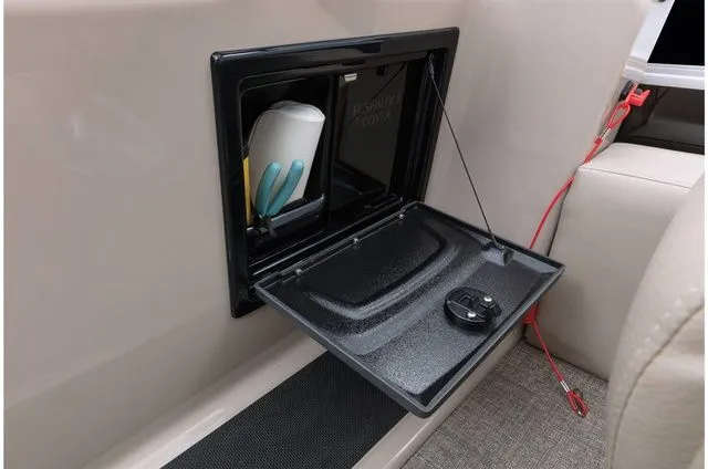 Slide: The Image of Open storage compartment in 2022 Ranger 223FC boat. - 44