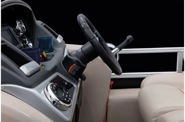 Slide: The Image of Steering wheel and dashboard of a 2022 Ranger 223FC boat. - 49