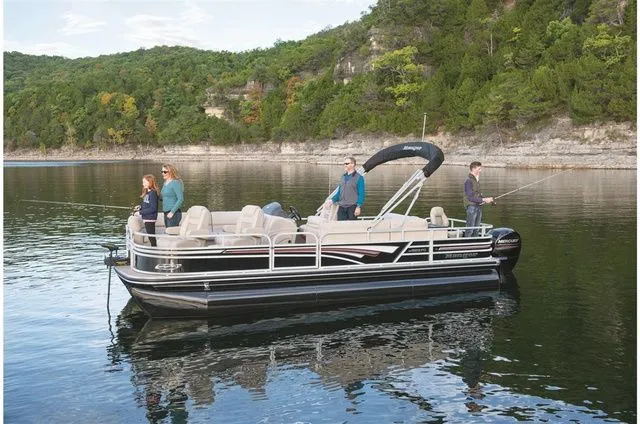 Slide: The Image of Ranger 223FC 2022 pontoon boat on a calm lake with anglers. - 6