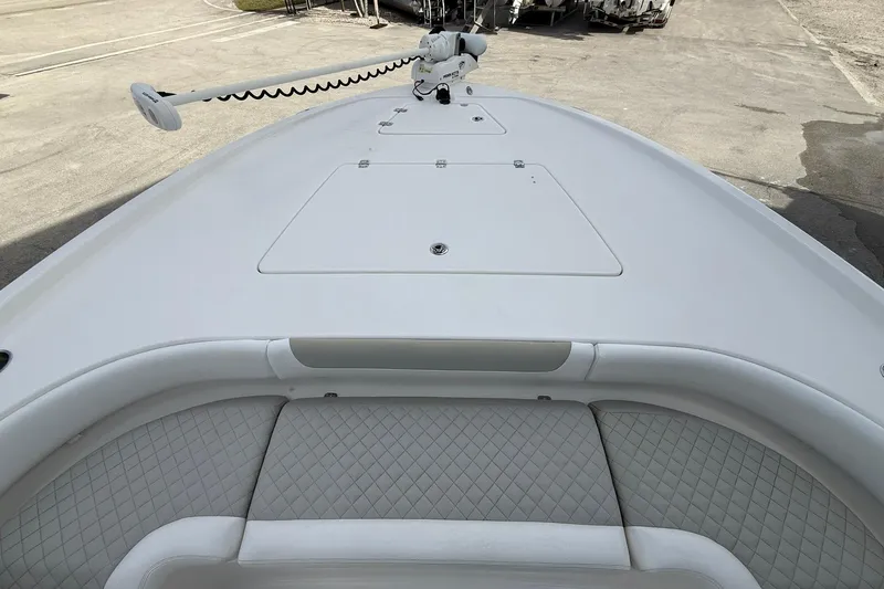 Slide: The Image of 2022 Caymas 28 HB Twin boat deck with seating and trolling motor. - 15