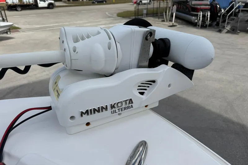 Slide: The Image of Minn Kota Ulterra motor on 2022 Caymas 28 HB Twin boat, parked outdoors. - 16