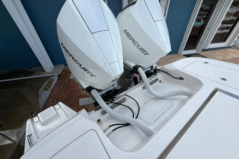 Slide: The Image of 2022 Caymas 28 HB Twin boat with dual Mercury outboard engines. - 4