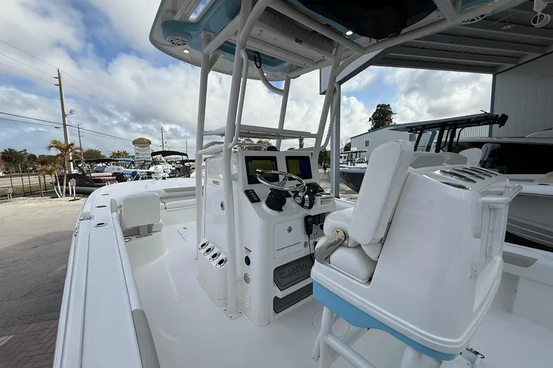 Slide: The Image of 2022 Caymas 28 HB Twin boat interior with helm, seating, and navigation equipment. - 7