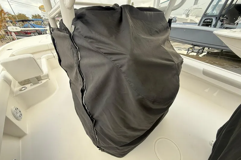 Slide: The Image of 2022 Caymas 28 HB Twin boat interior with covered console and seating area. - 8