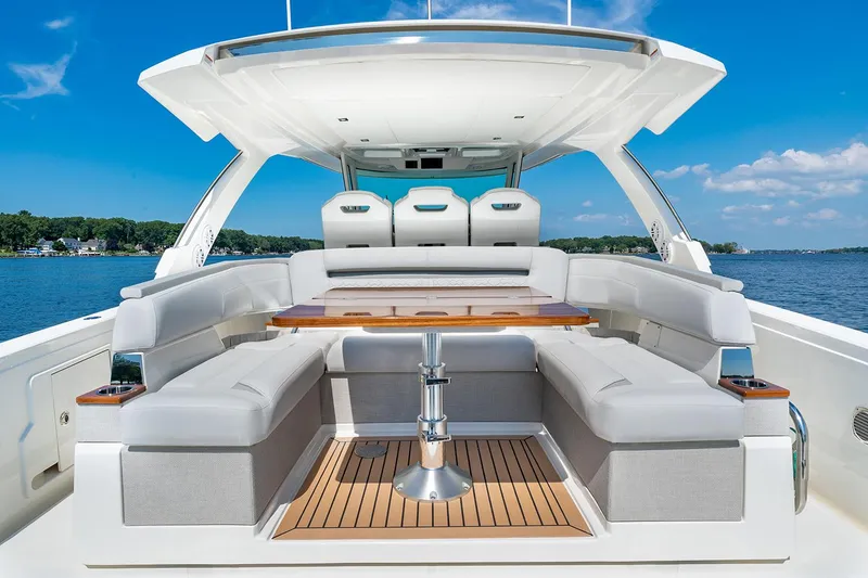 Slide: The Image of Manufacturer Provided Image: 2025 Tiara Yachts 38 LS luxury boat interior with spacious seating and wooden table. - 16