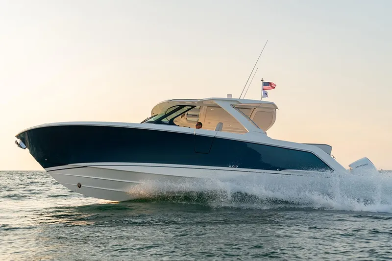 Slide: The Image of Manufacturer Provided Image: 2025 Tiara Yachts 38 LS cruising on water at sunset. - 4