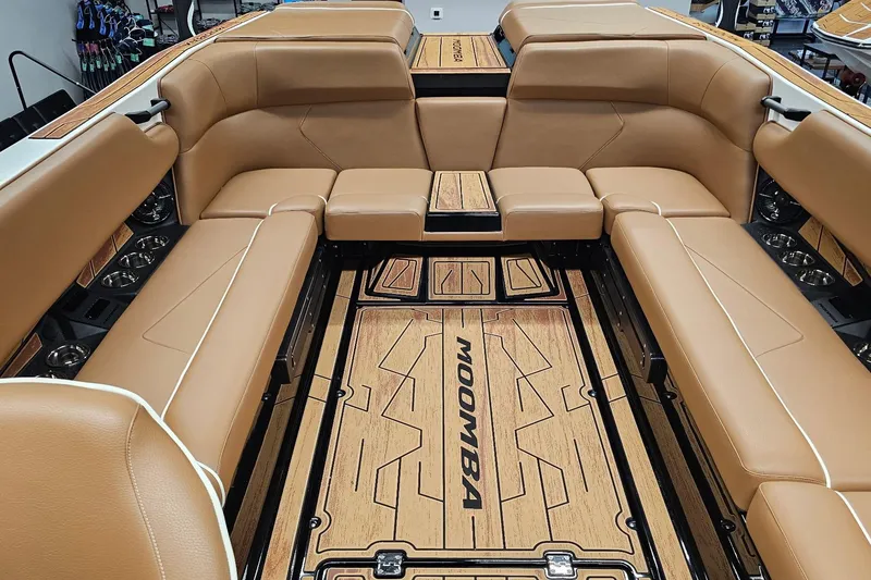 Slide: The Image of Luxurious interior of 2026 Moomba Tykon boat with tan leather seating and stylish flooring. - 11
