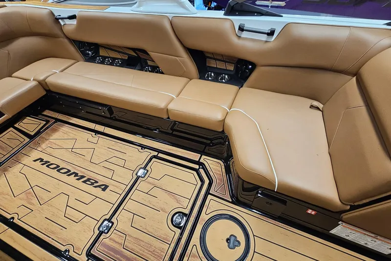 Slide: The Image of Luxurious interior of 2026 Moomba Tykon boat with tan seating and stylish flooring. - 12