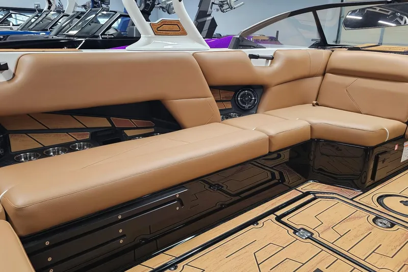 Slide: The Image of Luxurious interior of 2026 Moomba Tykon boat with tan leather seating and modern design. - 14