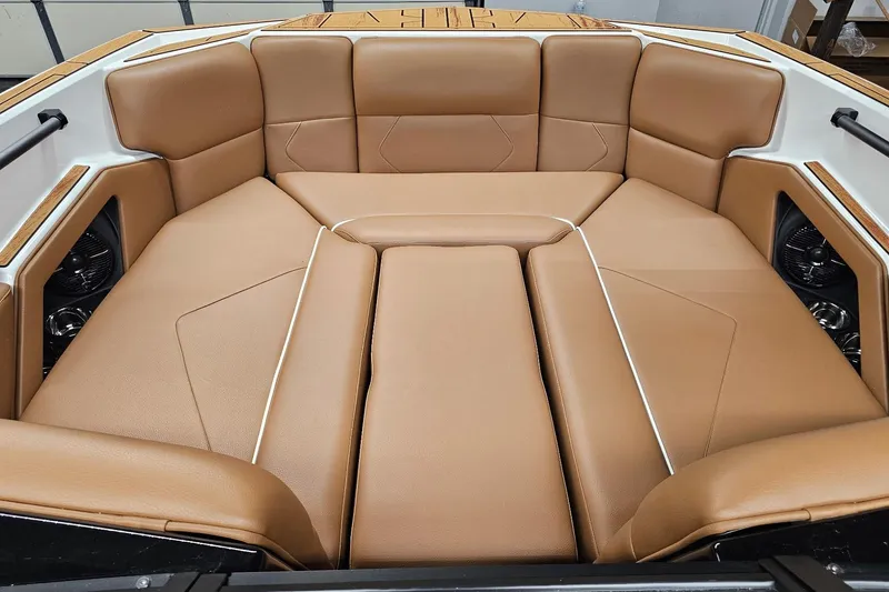 Slide: The Image of Luxurious tan interior of 2026 Moomba Tykon boat, featuring spacious seating and sleek design. - 17