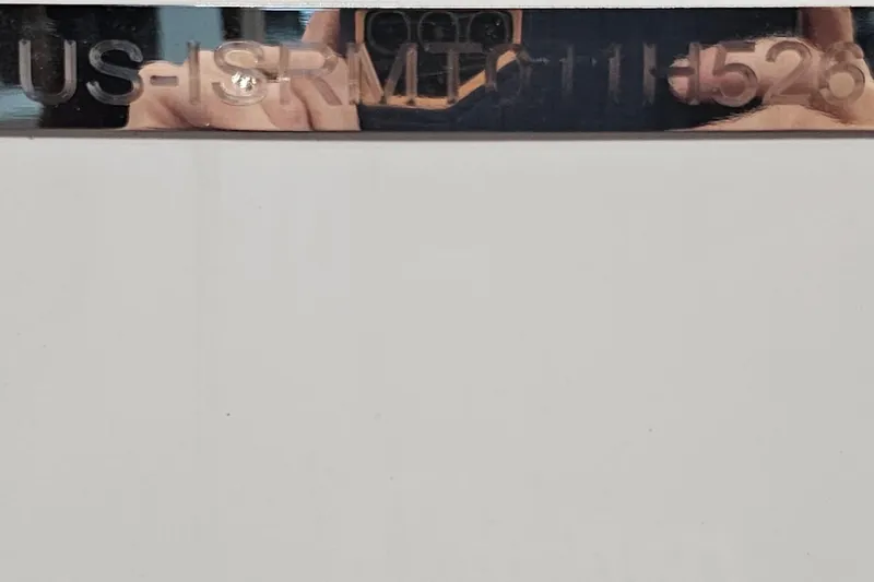 Slide: The Image of Moomba Tykon 2026 boat hull identification number on metallic surface. - 19