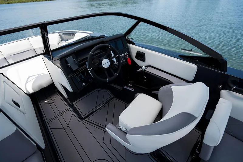 Slide: The Image of 2026 Moomba Tykon boat on trailer in showroom, featuring sleek design and modern features. - 5