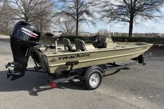 Slide: The Image of 2026 Tracker Grizzly 1754 SC boat with Mercury outboard motor on trailer. - 10