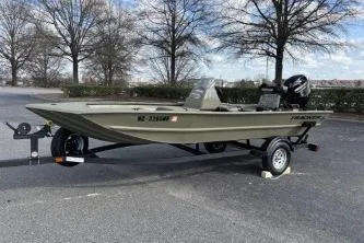 Slide: The Image of 2026 Tracker Grizzly 1754 SC boat on trailer in outdoor setting. - 4