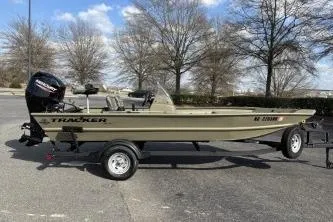 Slide: The Image of 2026 Tracker Grizzly 1754 SC boat on trailer, parked outdoors. - 8