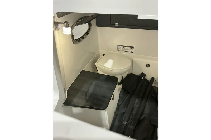 Slide: The Image of 2026 Monterey Elite 25 SD boat interior with compact bathroom amenities. - 13