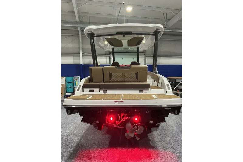 Slide: The Image of 2026 Monterey Elite 25 SD boat rear view with illuminated propeller and spacious deck. - 6