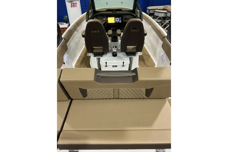 Slide: The Image of 2026 Monterey Elite 25 SD boat interior with luxurious seating and modern dashboard. - 7