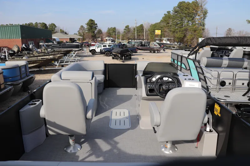 Slide: The Image of 2026 Bentley Pontoons Legacy 223 Swingback interior with modern seating and steering console. - 11