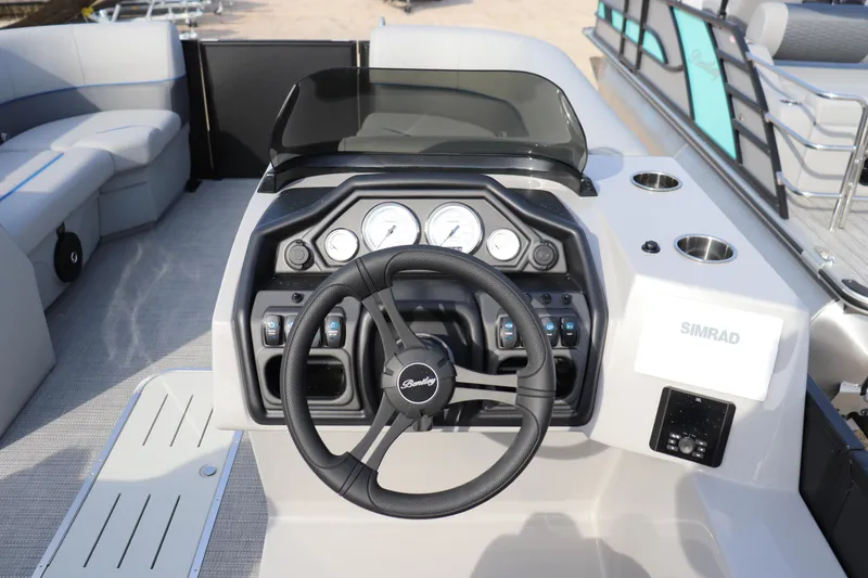 Slide: The Image of 2026 Bentley Pontoons Legacy 223 Swingback dashboard with steering wheel and control panel. - 5