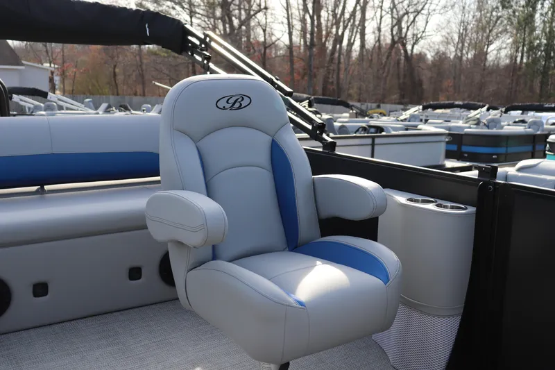 Slide: The Image of 2026 Bentley Pontoons Legacy 223 Swingback with luxurious seating and cup holders. - 6