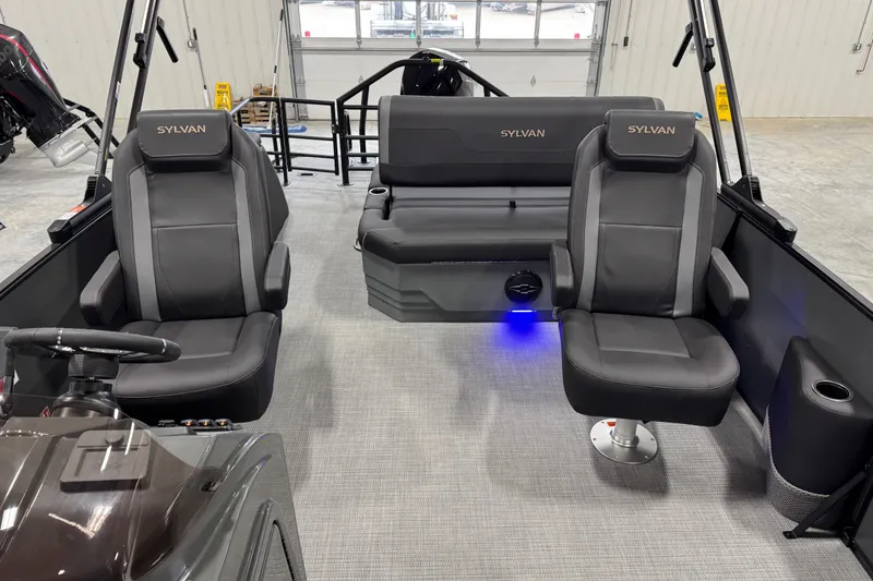 Slide: The Image of Interior of 2026 Sylvan X5 boat with sleek black seating and modern design. - 10