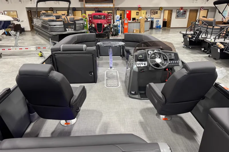 Slide: The Image of Interior of 2026 Sylvan X5 boat with modern seating and control panel. - 12