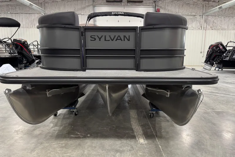 Slide: The Image of 2026 Sylvan X5 pontoon boat in showroom, front view, sleek design. - 5