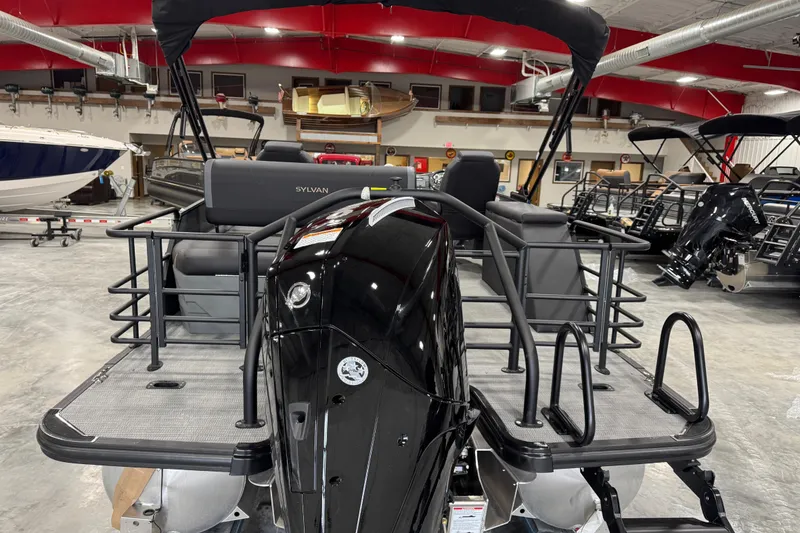 Slide: The Image of 2026 Sylvan X5 pontoon boat in showroom, featuring sleek design and modern amenities. - 6