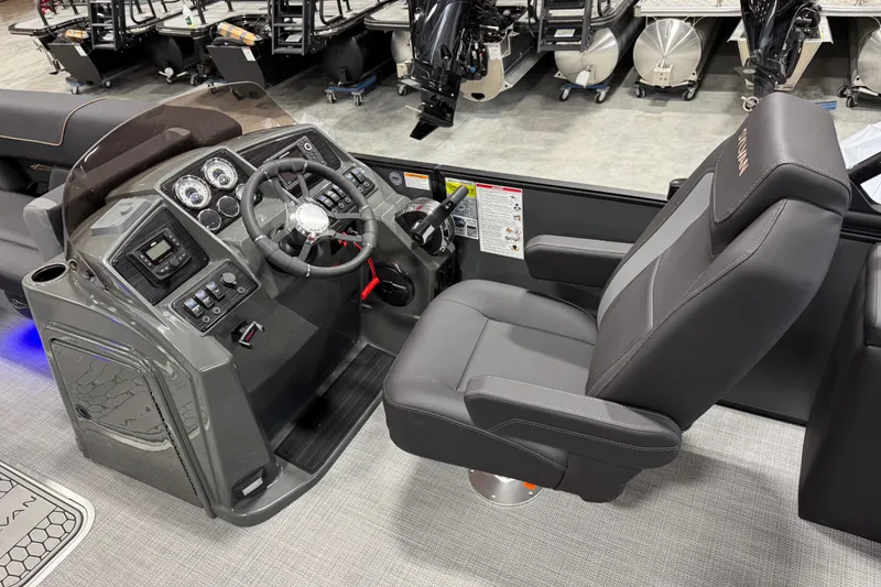 Slide: The Image of 2026 Sylvan X5 boat cockpit with modern steering and comfortable captain's chair. - 8