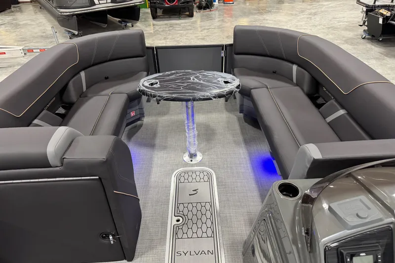 Slide: The Image of Luxurious interior of 2026 Sylvan X5 boat with sleek seating and modern table design. - 9