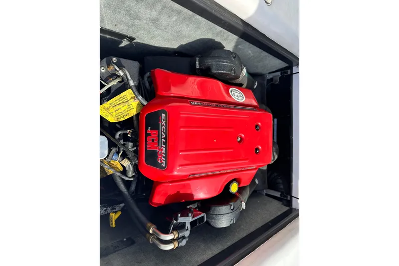 Slide: The Image of Red PCM Excalibur 330 engine in 2004 Nautique Air Nautique 226 boat. - 12