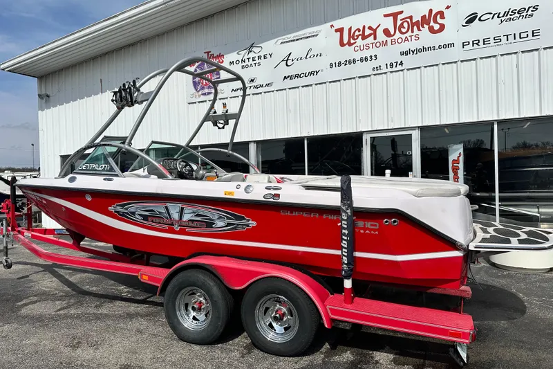 Slide: The Image of 2004 Nautique Air Nautique 226 boat on trailer at Ugly John's Custom Boats dealership. - 3