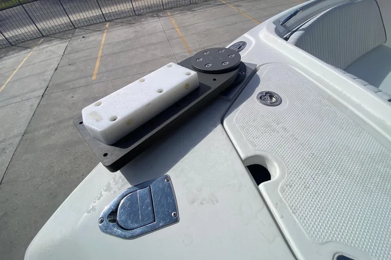 Slide: The Image of 2006 Sailfish 2360 CC boat deck with mounted equipment and seating area. - 16