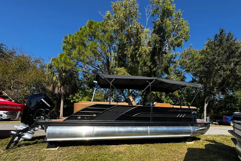 The Image of 2026 Bentley Pontoons Elite 253 Admiral pontoon boat with canopy, parked on grass. - 0