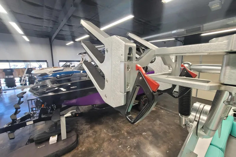 Slide: The Image of 2020 MasterCraft XT23 boat in showroom with advanced wakeboard rack. - 18