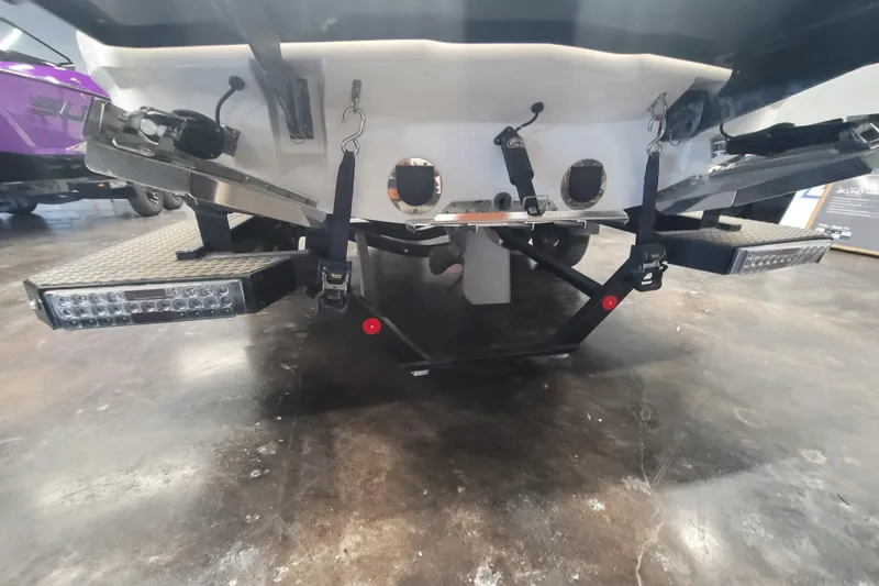 Slide: The Image of Rear view of 2020 MasterCraft XT23 boat with swim platform and LED lights. - 8