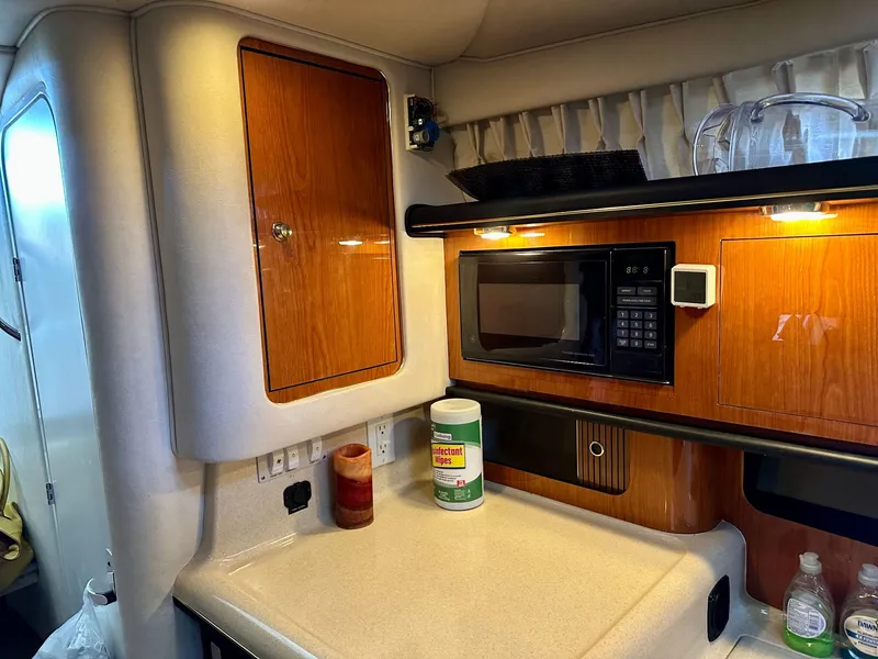 Slide: The Image of Sea Ray 340 Sundancer 2001 kitchen area with microwave. - 12