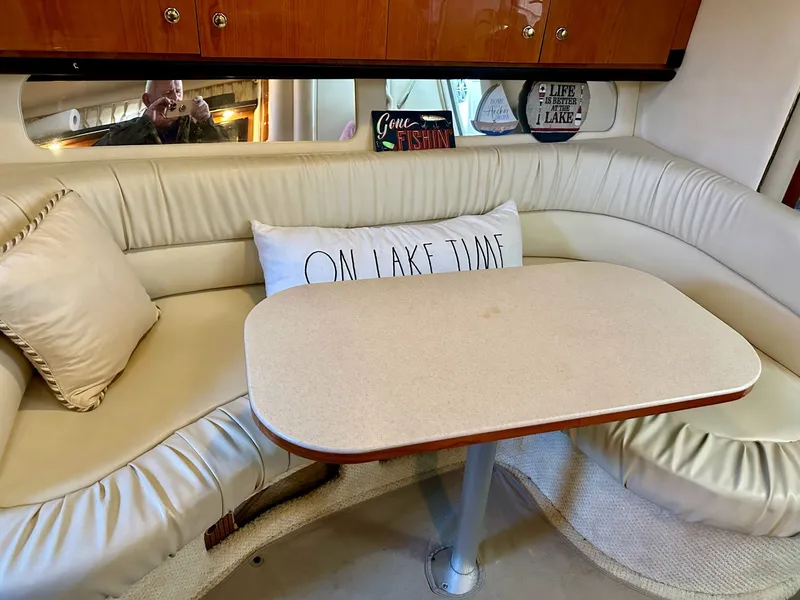 Slide: The Image of Interior of 2001 Sea Ray 340 Sundancer with cozy seating area. - 7
