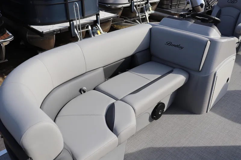 Slide: The Image of 2026 Bentley Pontoons 223 Bolt with luxurious gray seating and sleek design. - 2