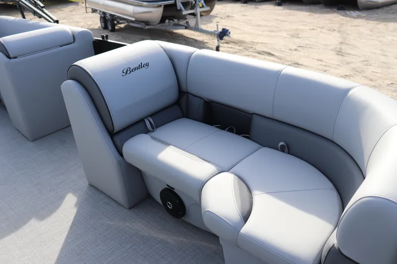 Slide: The Image of 2026 Bentley Pontoons 223 Bolt with luxurious gray seating on a pontoon boat. - 3
